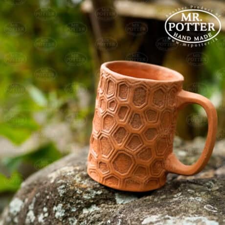 Handcrafted terracotta mug with geometric honeycomb pattern, eco-friendly kitchenware from Mr. Potter.
