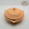 Handmade terracotta pot with intricate embossed design for home decor and plant display.